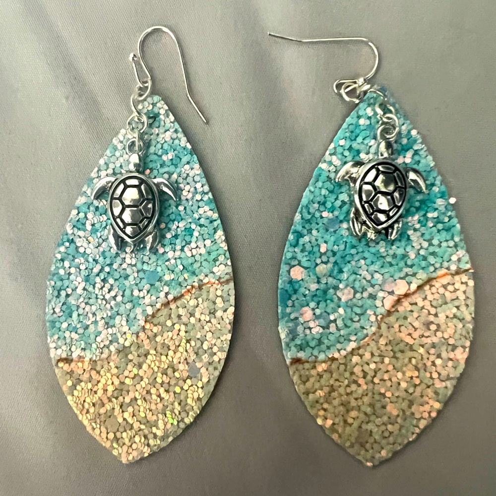 New crushed sequins beach theme leather teardrop earrings with sea turtle charm.